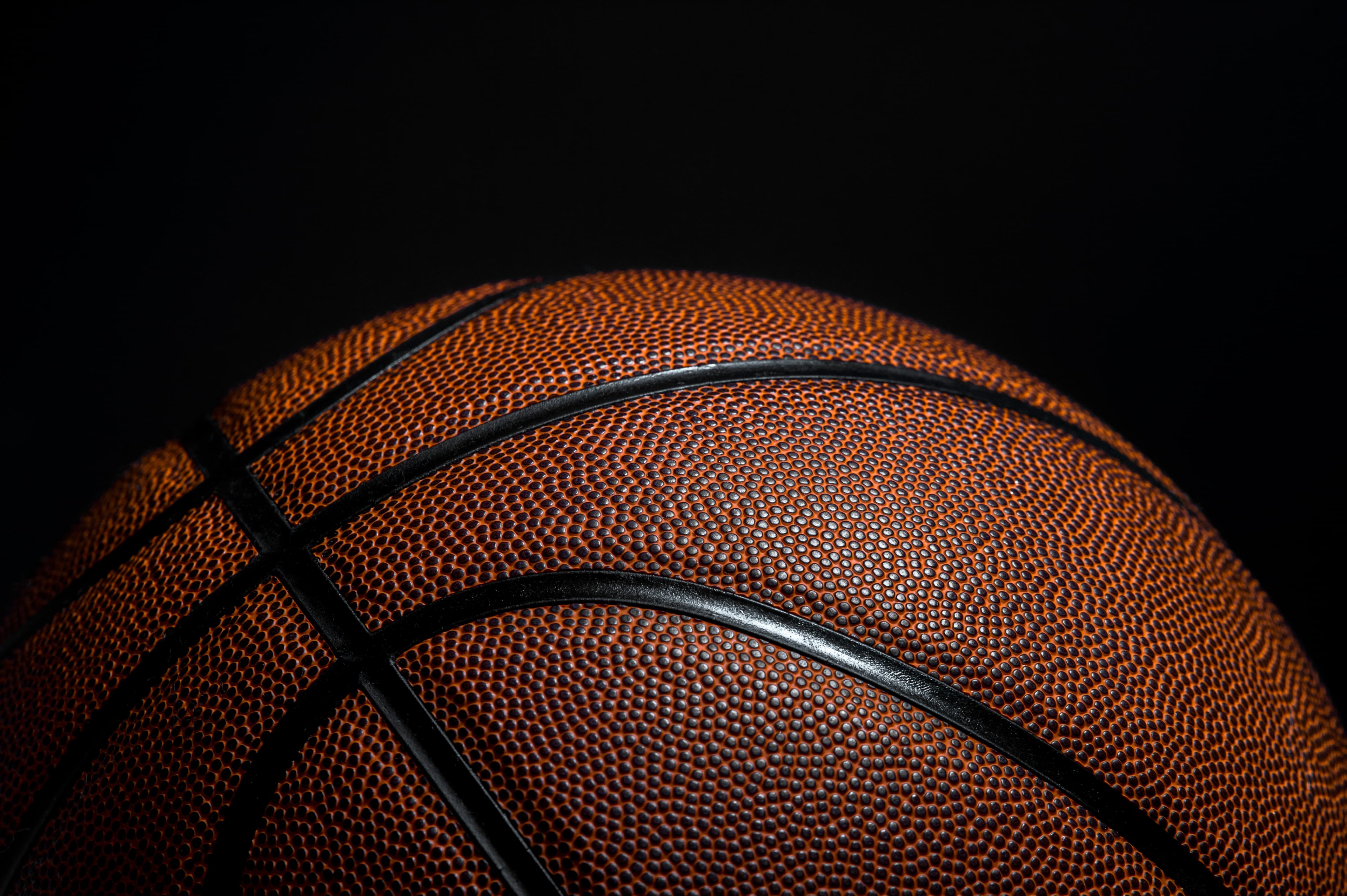 Close up Basketball Hoop Against Black Background